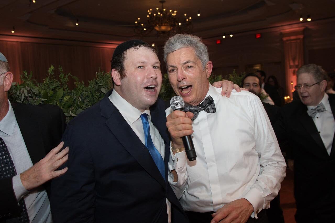 Jeremy Gaisin singing with Dennis Berman, father of the bride